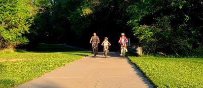 3 bike riders on a trail