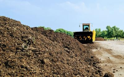 Pile of compost and equipment at Beatrice Compost Site