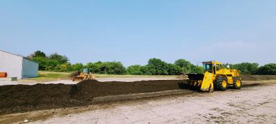 Windrow of Mulch and aerator equipment